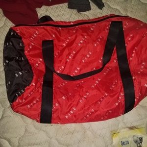 NWOT.Red and black PINK douffle bag.